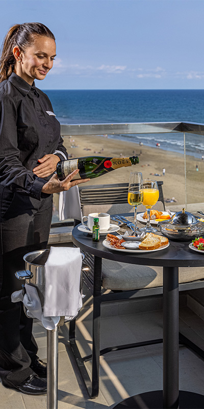  Room service on the terrace of the Junior Suite of the Hotel Faro, a Lopesan Collection Hotel in Maspalomas, Gran Canaria 